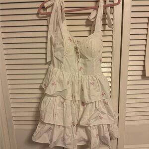 White Ruffled Dress with Pink Accents